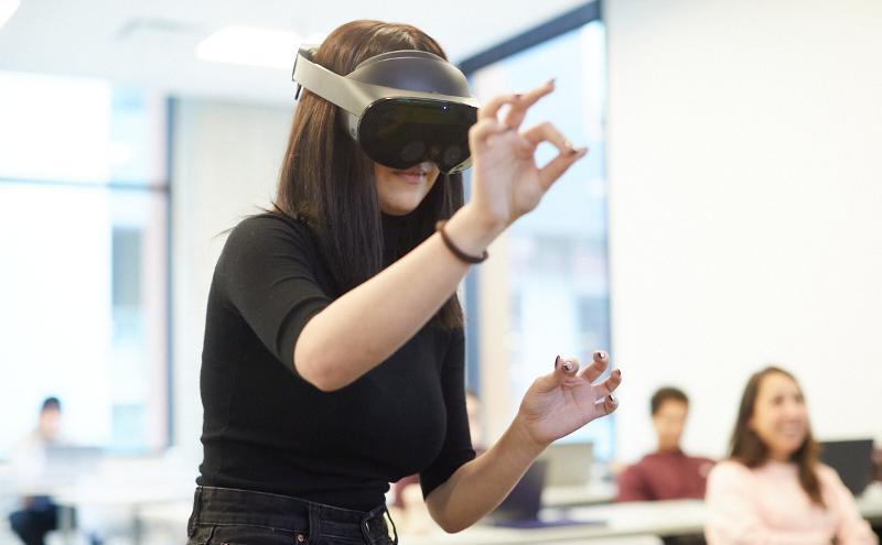 Students in an interaction design class exploring the possibilities of virtual reality (VR)