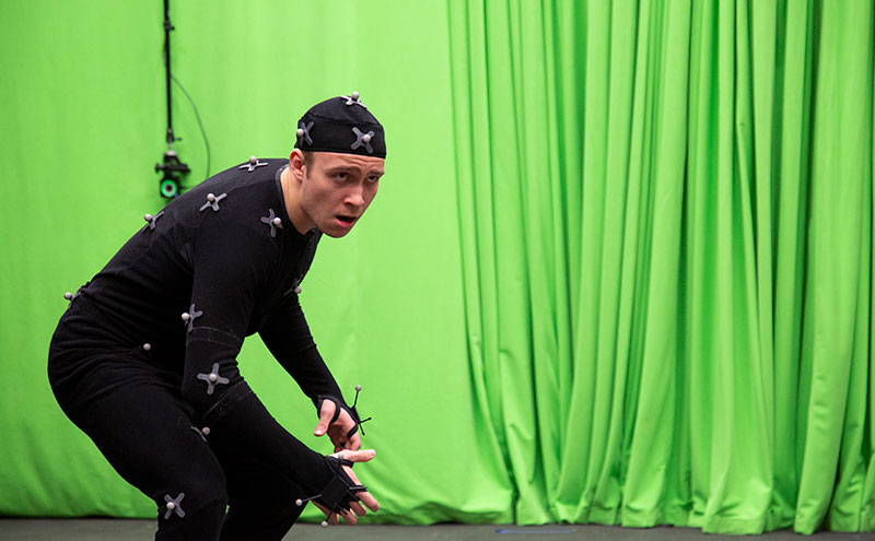 CapU student wearing a motion capture suit.