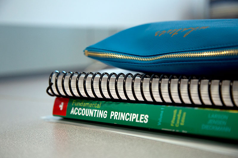 A stack of accounting textbooks.