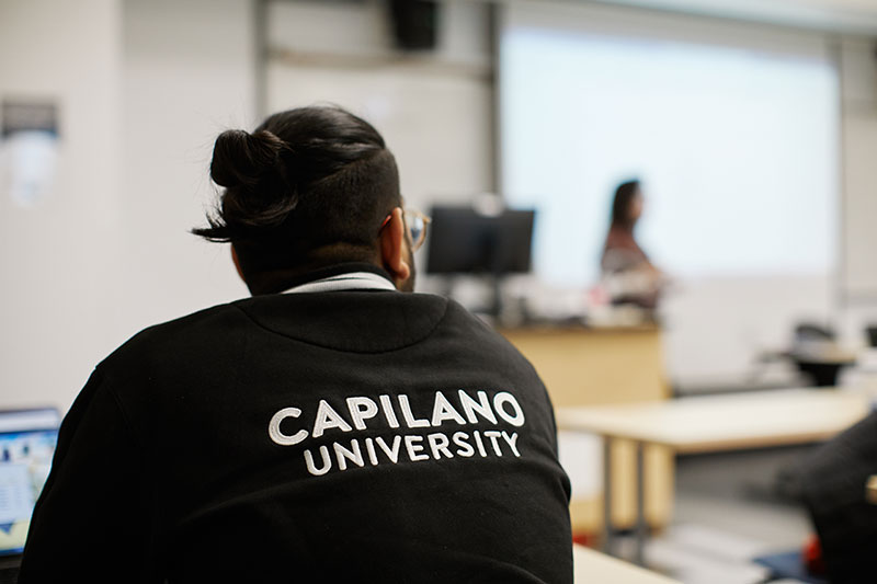 CapU student wearing a university jacket.