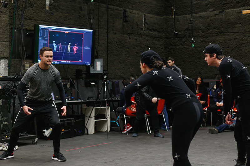 CapU visual effects students taking part in a motion capture session.