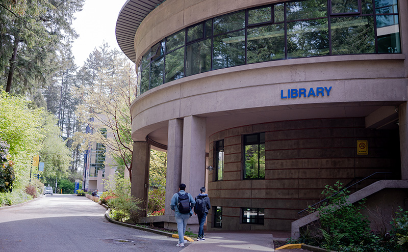 Students walking outside the Library Building