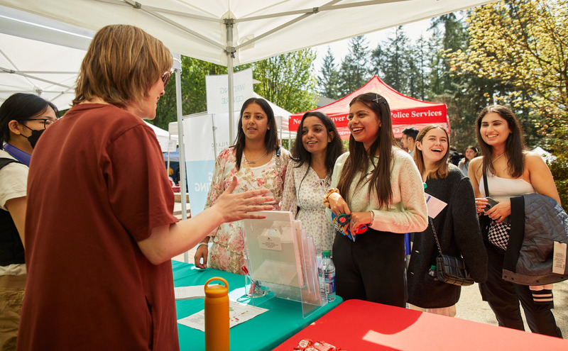 Students at an orientation booth for the summer term