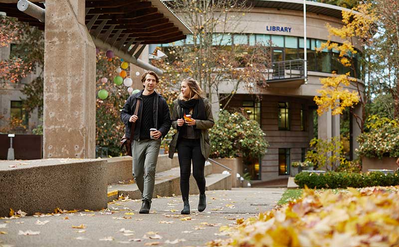 Students walking outside the North Vancouver Campus Library.