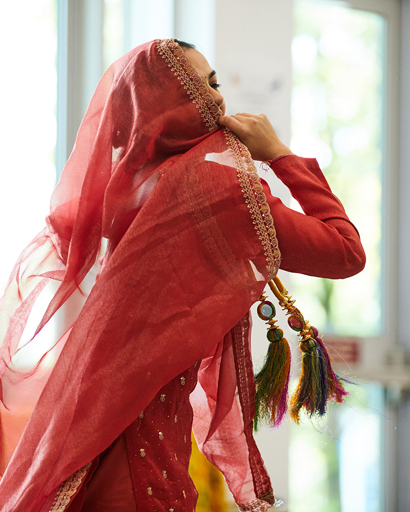 Student performing an Indian dance routine in the Birch Building Cafeteria