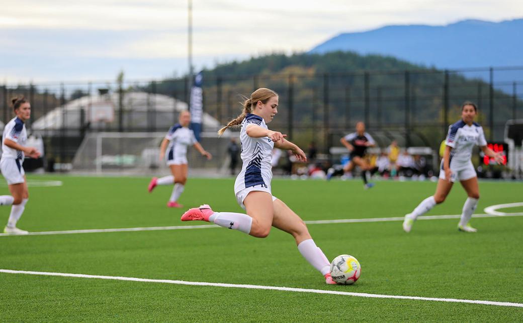 Blues forward Sasha Faris steps into a shot