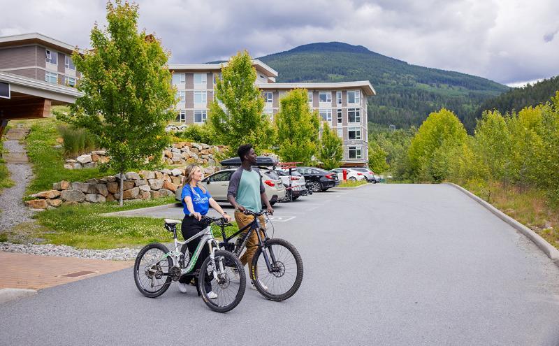 Students with bikes outside