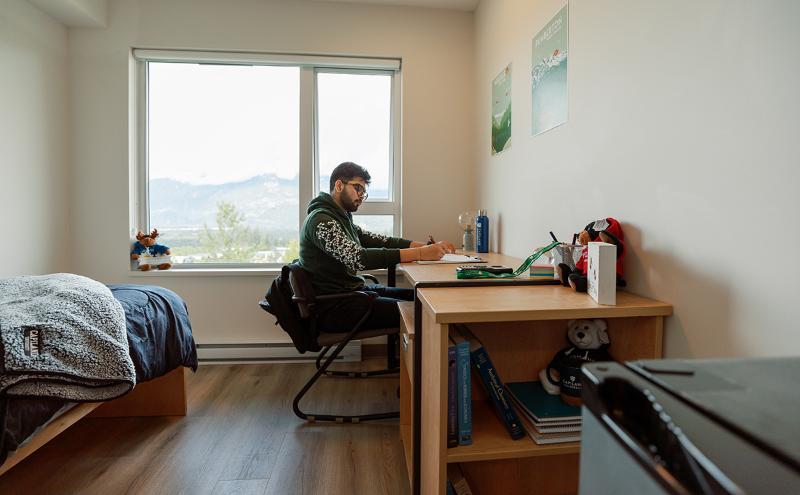 Student in room at CapU Squamish housing