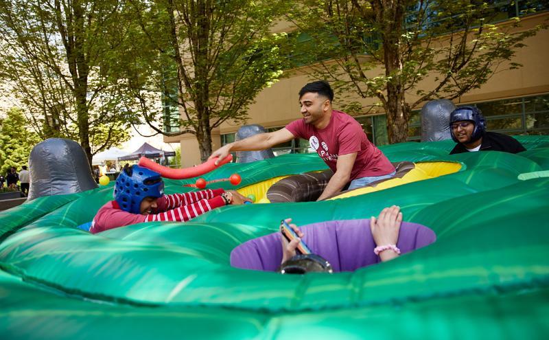 New CapU students having a ball in the Cedar Courtyard