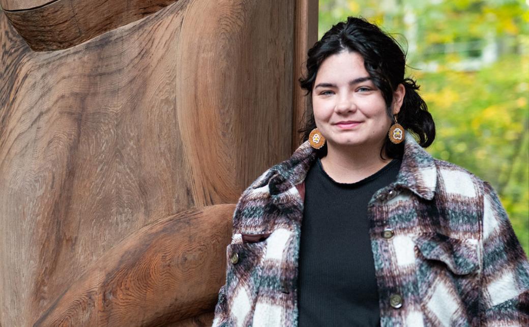 Christina Lennox standing beside the Indigenous pavilion