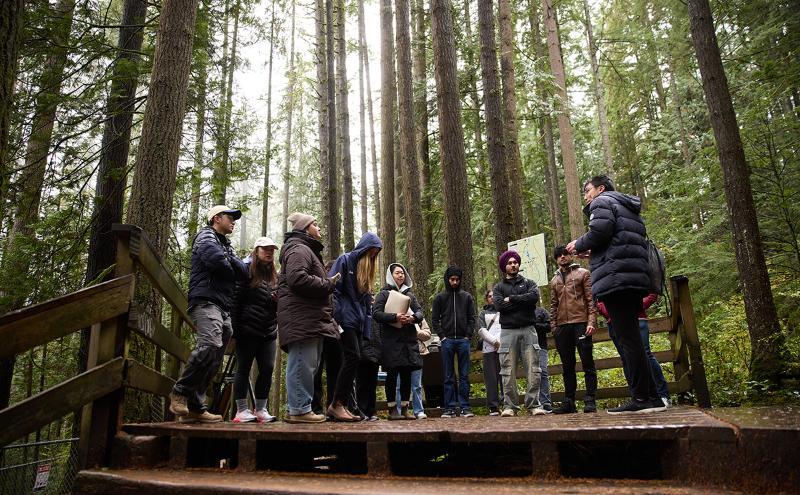 Students outside in class with instructor