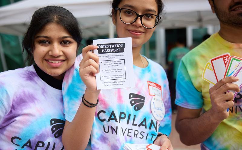 Student leaders handed out orientation passports as students arrived