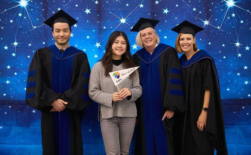 School of Business instructors in the photobooth with new students