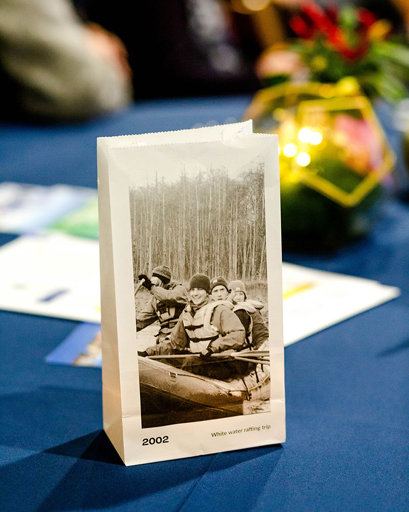 Past class adventures like a 2002 white-water rafting trip adorn grab bags at the OREC reunion. Photo credit: Maxine Bulloch Photography