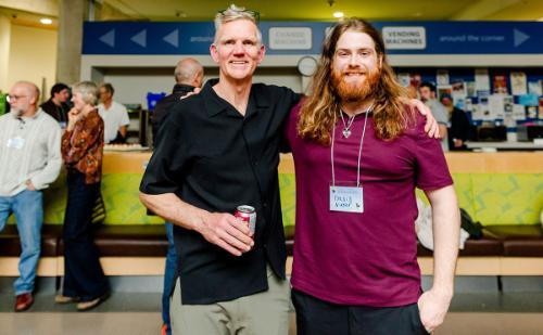 OREC faculty Greig Gjerdalen catches up with alum David Nufer at the Reckies Reunited celebratory event in October 2024. Photo credit: Maxine Bulloch Photography