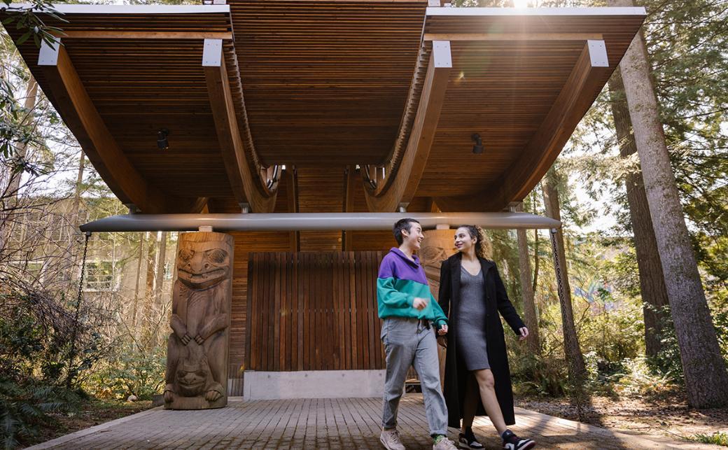 Students walking in front of Indigenous Pavilion