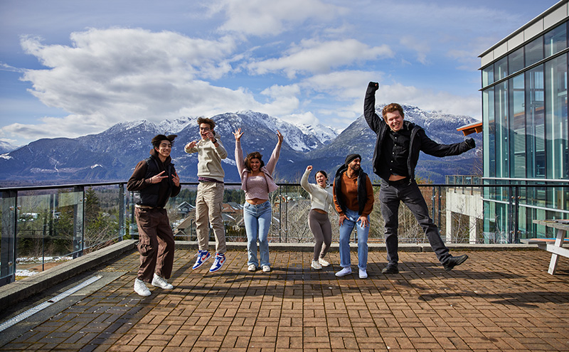 Students jumping at CapU Squamish