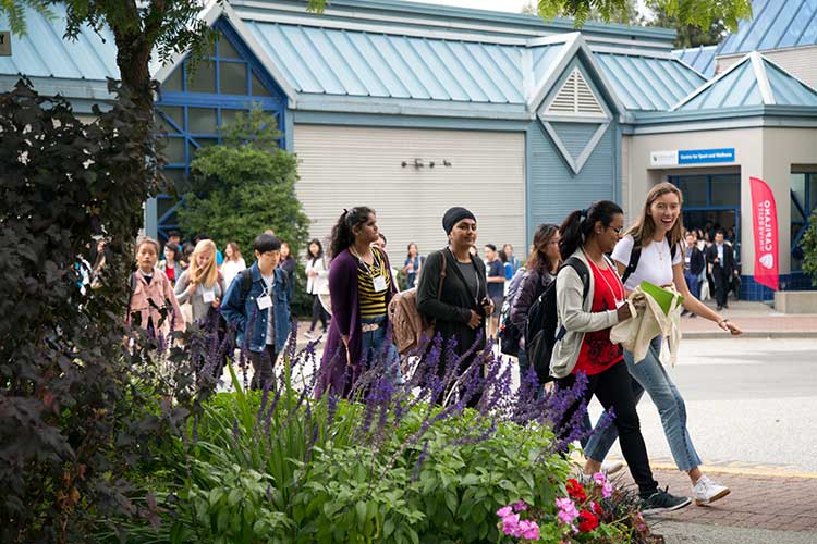 Students walk out of the Centre for Sport and Wellness during a break in the Centre for International Experience's International Student Orientation on Thursday, Aug. 31, 2018.