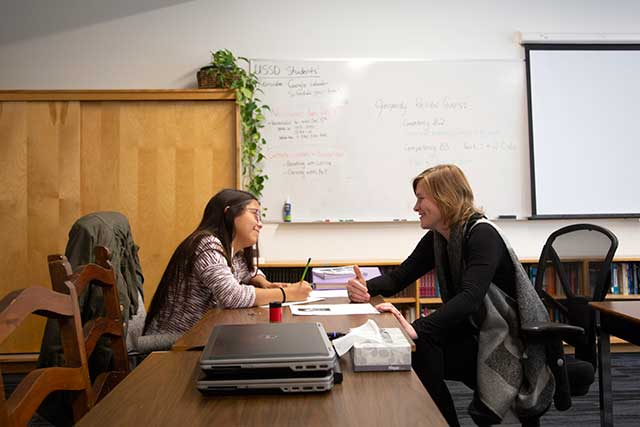 Instructor Jennifer Fitzgerald works with a student at the Ts’zil Learning Centre in Mount Currie on Friday, Nov. 16, 2018.