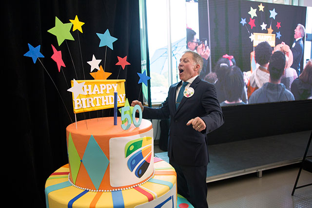 President Paul Dangerfield blows out a candle at the official birthday celebration on Sept. 10, 2018. The event featured musical performances, special guests, a message from Prime Minister Justin Trudeau and a reception for the first students who attended the university when its doors opened in 1968.