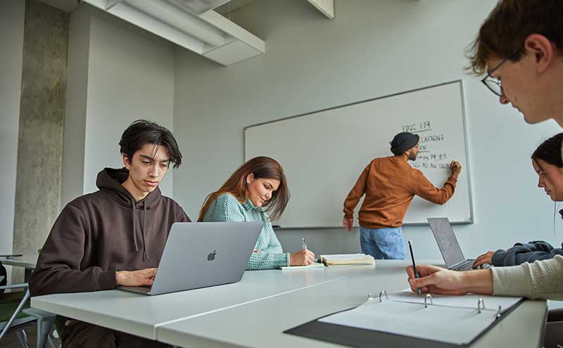 Students working together in a classroom.