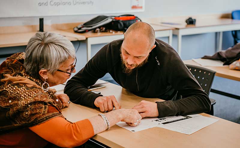 Instructor working with a student at Sunshine Coast Campus.