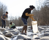 Student outdoors doing field work