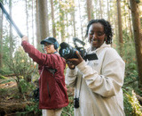 CapU Outdoor Filmmaking students using a camera and boom microphone on a shoot i