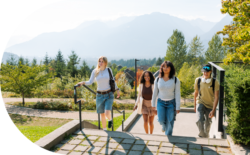 Students walking up a flight of stairs at CapU Squamish.