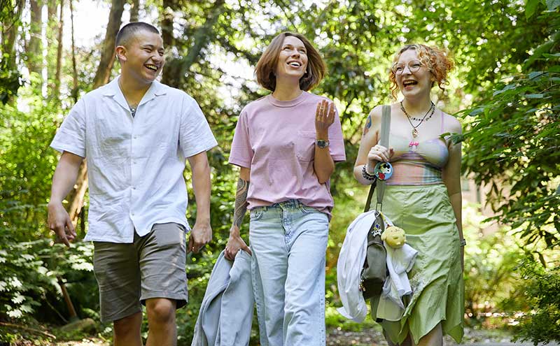 CapU students walking in the North Vancouver Campus forest.