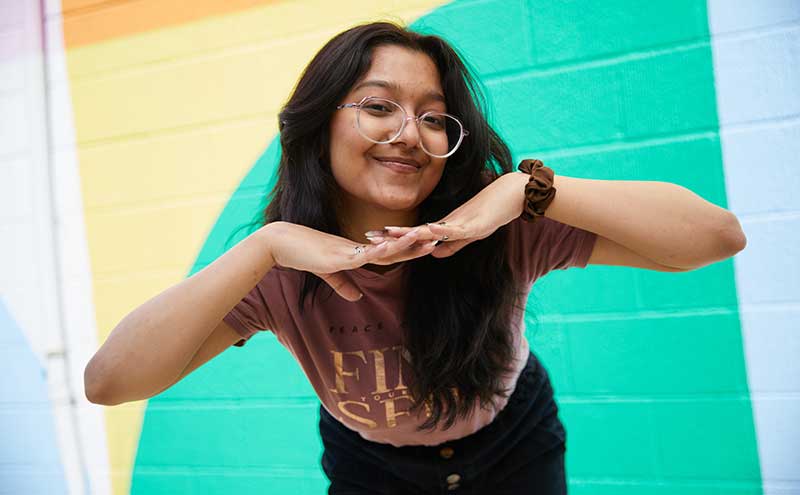 CapU student posing at North Vancouver Campus.