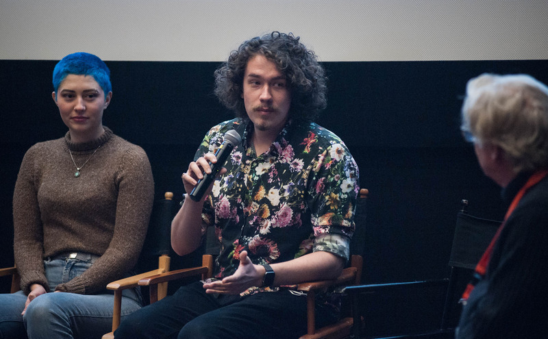Communication Studies students presenting with a microphone