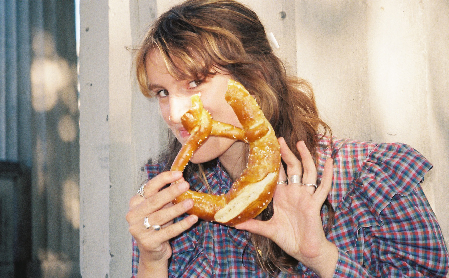 A student holding a pretzel