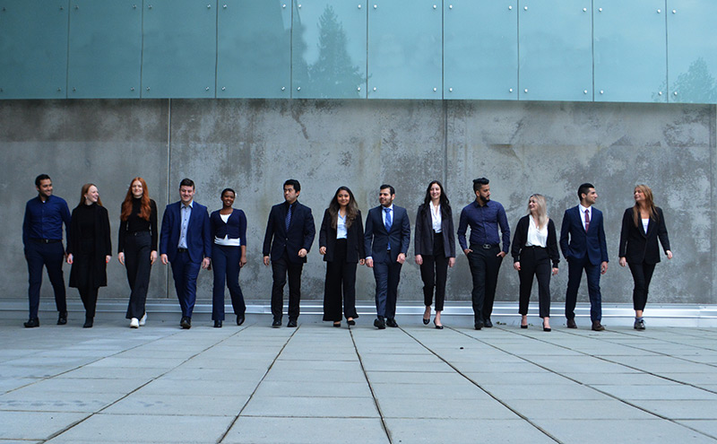 Capilano University Marketing Association students in a posed image in front of the Nat & Flora Bosa Centre for Film and Animation.