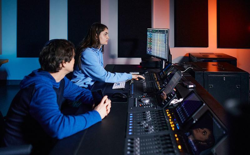 Film students working in an audio editing suite. 