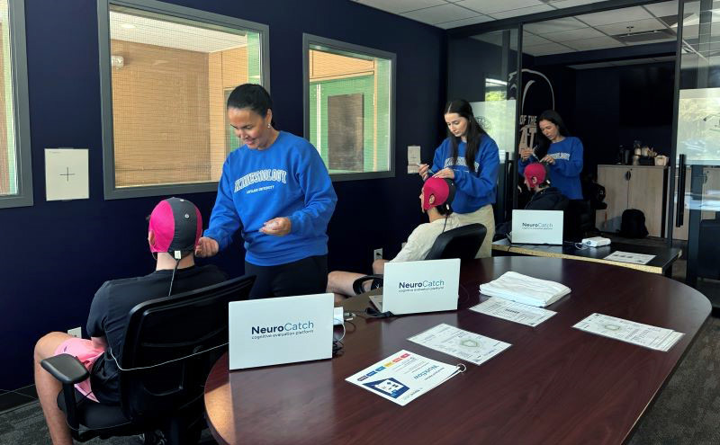 Kinesiology instructor Donna Perry and research assistants Chelsea Watson and Jeenat Virk use the NeuroCatch Platform to measure athletes’ cognitive function for the RESILIENCE Project. A recent $151,200 NSERC-ARTI grant enabled the purchase of the cutting-edge EEG device.