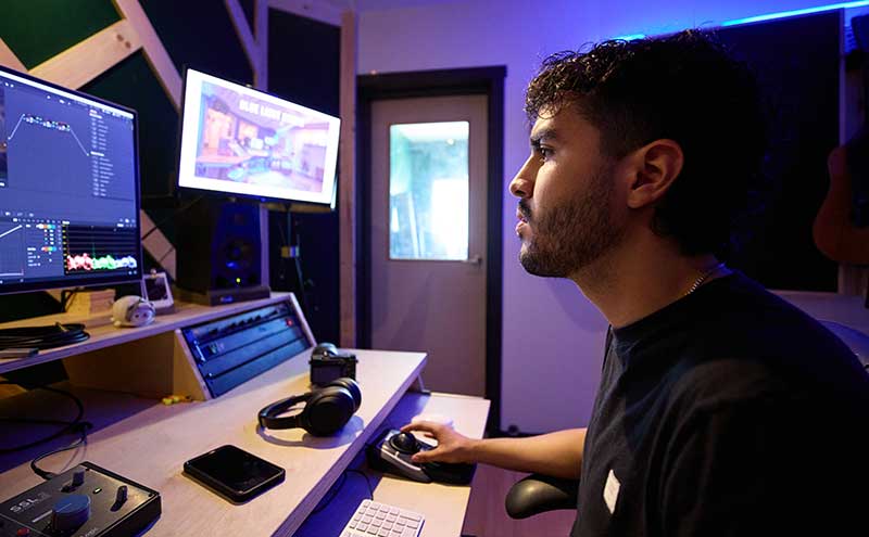 CapU student Joel Miguel Norena Cardenas working at Blue Light Studio.