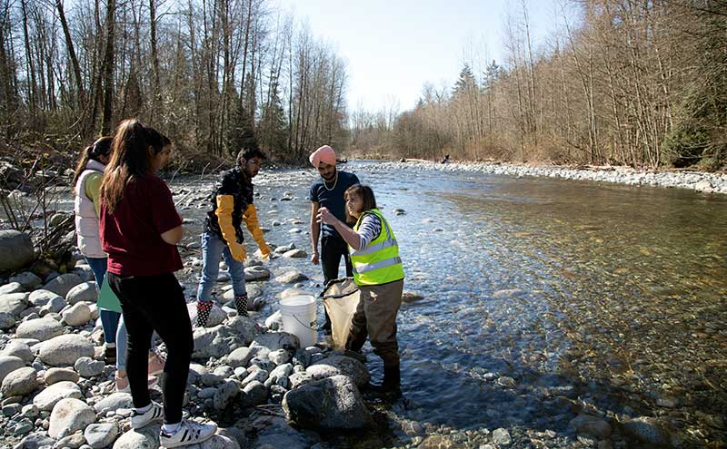 CapU students working on an aquatic ecology project.