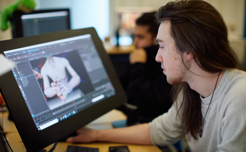 Students learning design on a computer