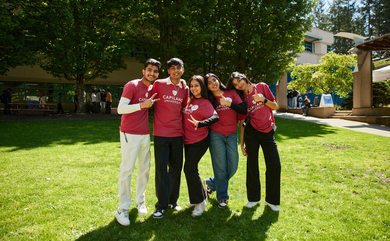 Students smiling at the welcome fair