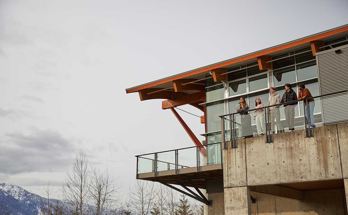 Students standing on the deck by the Squamish Campus cafeteria.