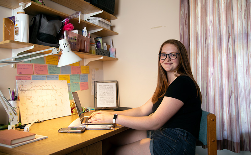 Student at desk in residence