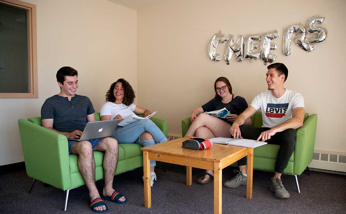 CapU students hanging out in a Residence Lounge area.