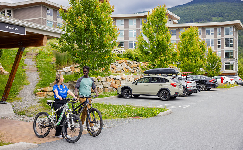 Students with bikes outside CapU Squamish housing